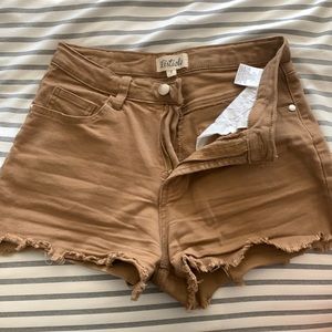 Tan shorts size small. Fits like a size 25.